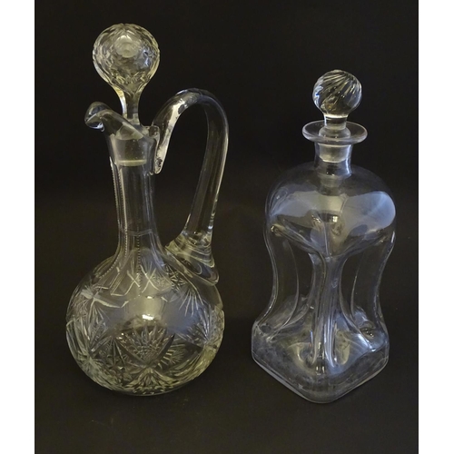 273 - A 19thC pinched crystal decanter, the stopper with swirl decoration, together with a 19thC claret ju... 