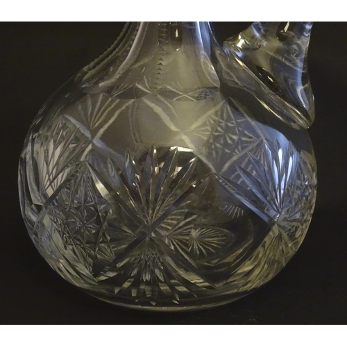 273 - A 19thC pinched crystal decanter, the stopper with swirl decoration, together with a 19thC claret ju... 