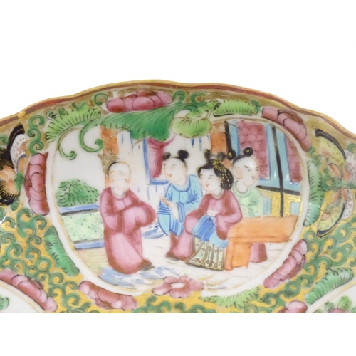 45 - A Chinese / Cantonese plate decorated with figures, birds, butterflies, flowers, and scrolling folia... 