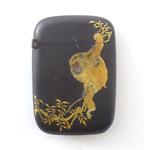 A Japanese vesta case with Komai style damascene decoration depicting a monkey in a tree and a bird on a branch. Character marks lower right. Approx. 2 1/4" x 1 1/2" x 1/4"