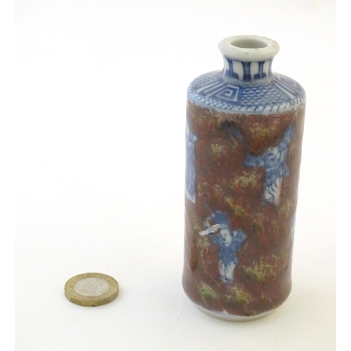 14 - A Chinese snuff bottle with blue and white figures and a mottled ground. Character marks under. Appr... 