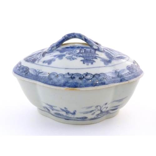 17 - A Chinese blue and white soup tureen of quatrefoil form decorated with a landscape scene with pagoda... 