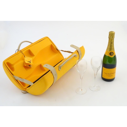 2180 - A cased bottle of Veuve Cliquot Ponsardin 'Veuve Traveller', the case containing one 75cl bottle and... 