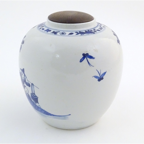 39 - An Oriental blue and white ginger jar decorated with a landscape scene with a figure on horseback wi... 