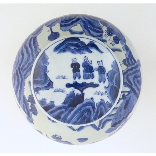 13 - An Oriental blue and white ginger jar decorated with a landscape scene with a dragon dance processio... 