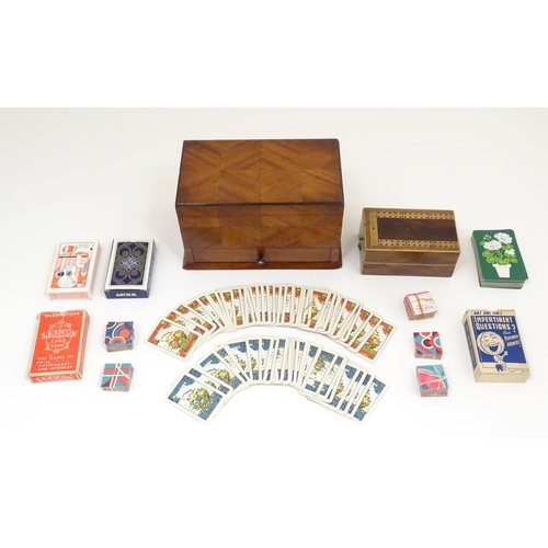 1294 - An early 20thC games compendium / box, the exterior with chequered mahogany panelling, fitted sectio... 