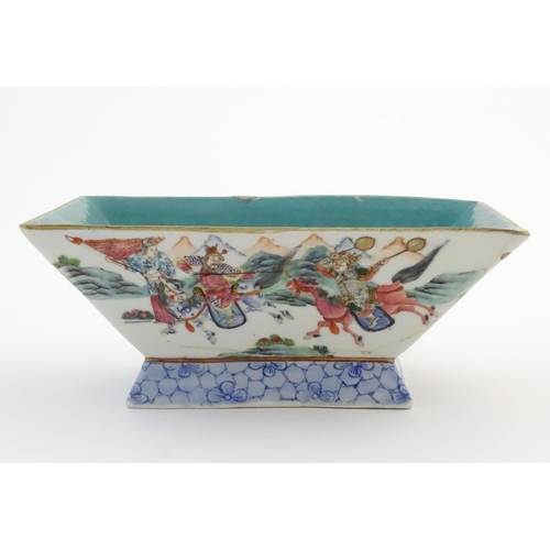 7 - A Chinese footed dish of rectangular form decorated with imperial style figures and attendants on ho... 