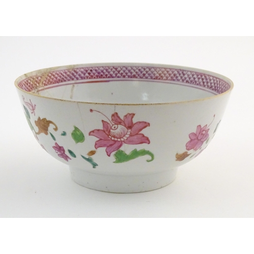 13A - A Chinese bowl decorated with flowers and foliage, with floral motif to centre of interior and bande... 