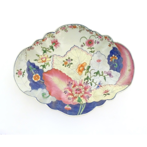20 - A Chinese export famille rose footed serving dish of lozenge form in the tobacco leaf pattern with f... 