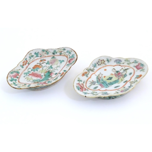 51 - Two Chinese famille rose footed dishes of lozenge form, one decorated with two figures in a landscap... 
