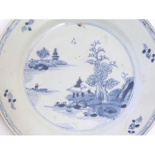 37 - A Chinese blue and white plate decorated with stylised flowers and foliage. Together with another de... 