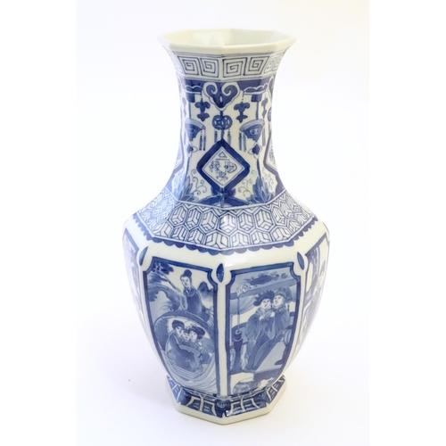 57 - A Chinese blue and white vase of octagonal form with panelled decoration depicting various figures, ... 