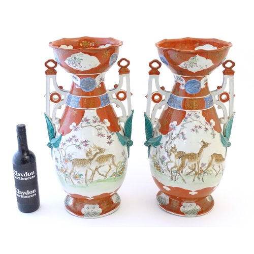 65 - A pair of Japanese vases with flared scallop edge rims and twin pierced handles with relief foliate ... 
