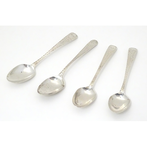294 - 4 Geo III silver teaspoons with bright cut decoration. Hallmarked London 1783/84 maker Hester Batema... 