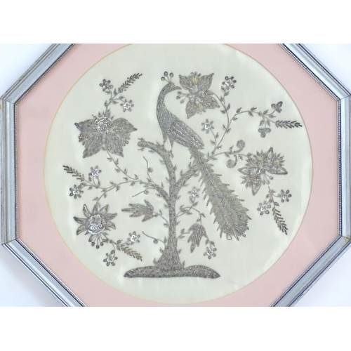 1936 - An early 20thC wirework embroidery depicting a stylised peacock bird in a tree with flowers and foli... 