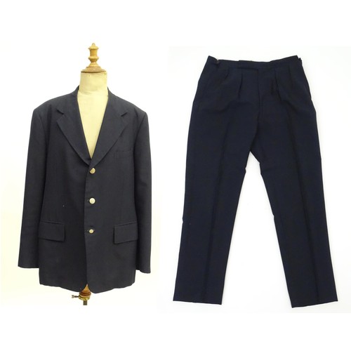 28 - A navy blue bespoke suit with tapered trousers and metal button detail by 'Sam's Tailor' based in Ho... 