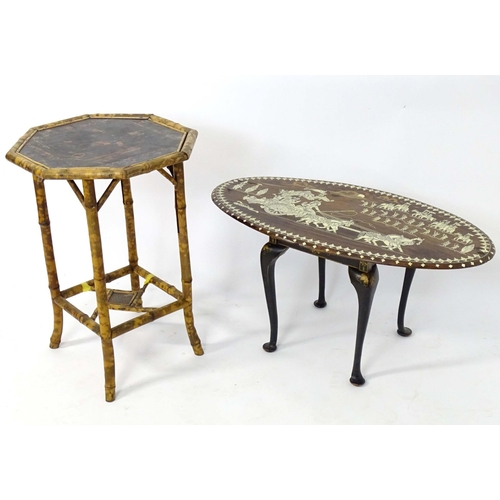 41 - An early 20thC Indian occasional table the oval top with inlaid decoration. Together with an early 2... 