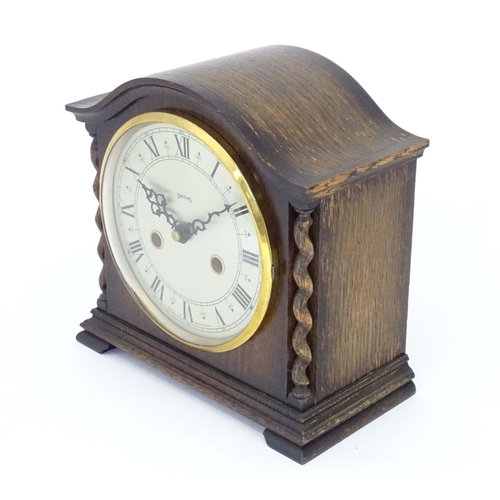 53 - A mis 20thC Smiths mantel clock with barley twist columns