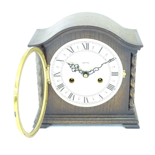 53 - A mis 20thC Smiths mantel clock with barley twist columns