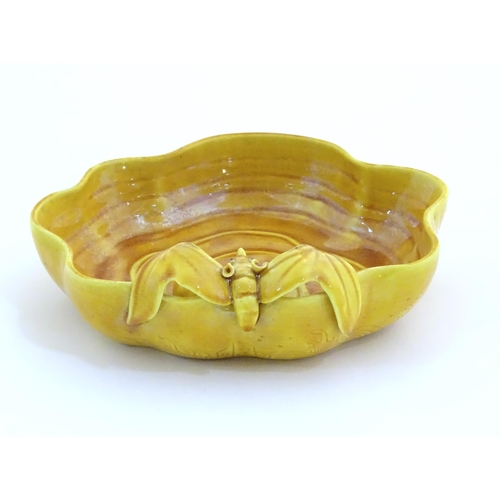 16 - A Chinese fluted edged yellow brush wash dish with relief bat and fruit decoration. Character marks ... 