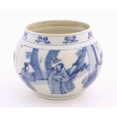 38 - A Chinese blue and white planter with four drilled hanging holes, decorated with panelled decoration... 