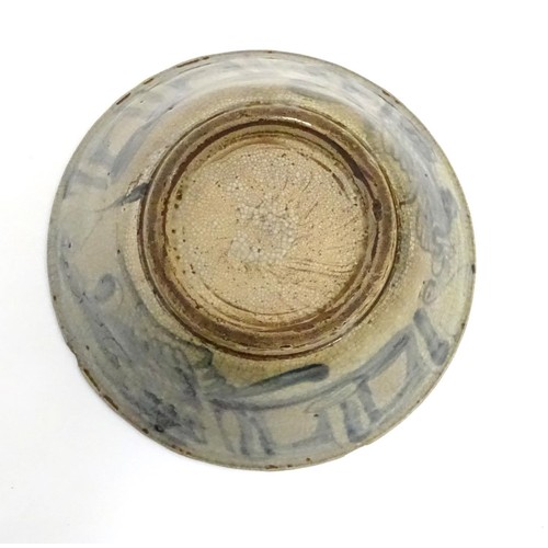49 - A Chinese crackle glaze bowl with blue brushwork detail. Approx. 3 3/4