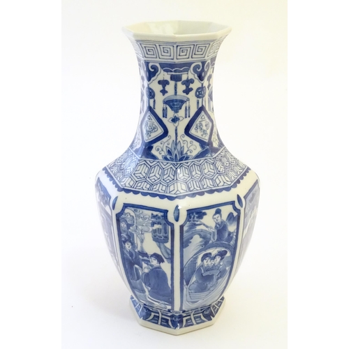 52 - A Chinese blue and white vase of octagonal form with panelled decoration depicting various figures, ... 