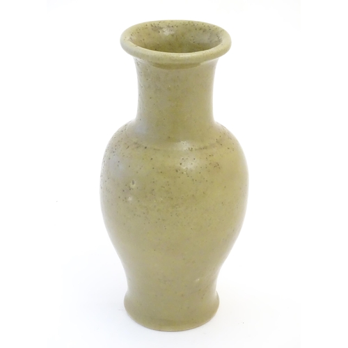 56 - A Chinese stoneware baluster vase with a crackle glaze. Approx. 13 1/2
