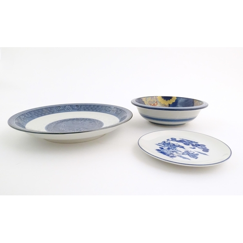 39 - A quantity of Oriental items to include a blue and white plate decorated with a landscape scene, a b... 
