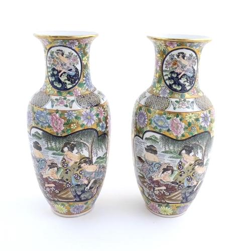 55 - A pair of Japanese vases of baluster form with panelled decoration depicting ladies by a river borde... 