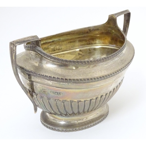 316 - A silver sugar bowl and cream jug hallmarked London 1905, maker Goldsmiths & Silversmiths Company Lt... 