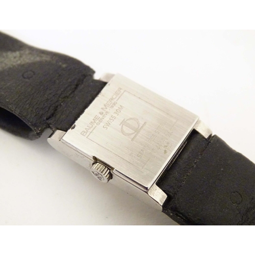 769 - A Baume & Mercier Vice Versa quartz wrist watch, the case signed and numbered having a black leather... 