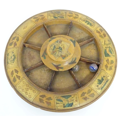 1389 - Toy: An early 19thC turned boxwood skating board / games wheel for the card game Pope Joan with cent... 