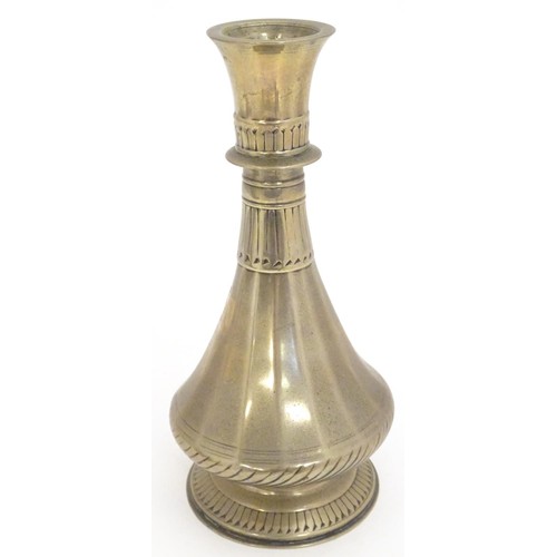 788 - An 18th / 19thC Indian brass vase with engraved banded detail. Approx. 8 1/4