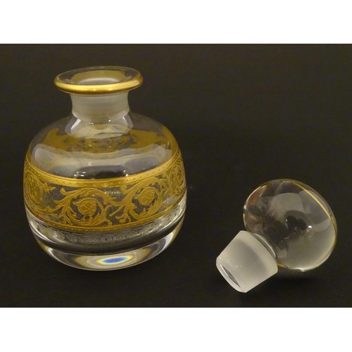 161 - St Louis Glass : A Saint Louis Thistle perfume / scent bottle and stopper, with banded gilt decorati... 