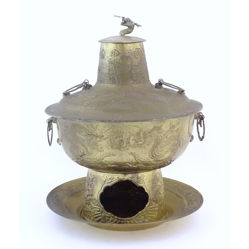 786 - A Chinese cast metal twin handled warming / steaming pot comprising, stand, burner section, bowl, ch... 