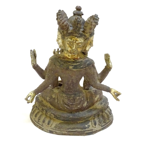 1026 - A South East Asian cast iron temple deity / Hindu God depicting Brahma with traces of polychrome dec... 