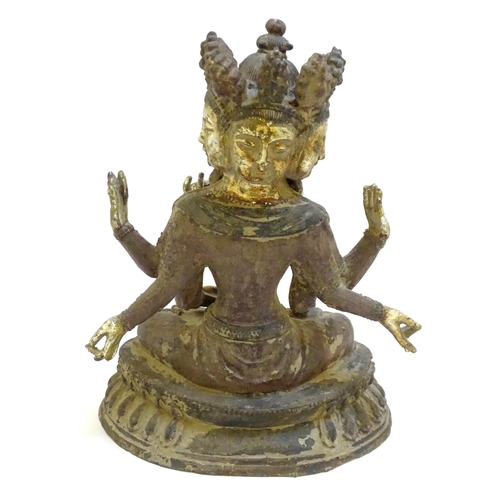 1026 - A South East Asian cast iron temple deity / Hindu God depicting Brahma with traces of polychrome dec... 