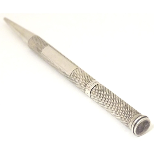 243 - A Mordan Everpoint Patent 179005 silver pencil with engine turned decoration and hallmarked London 1... 