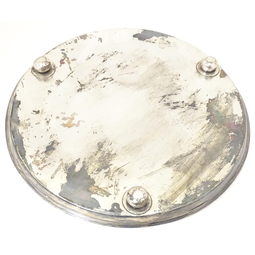 245 - A Victorian silver salver / tray of circular form standing on three squat bun feet, hallmarked Sheff... 