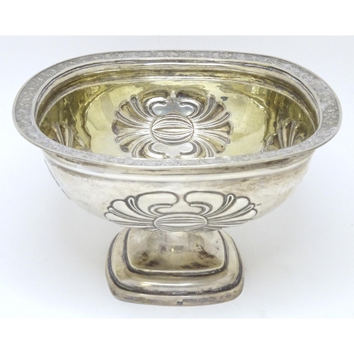 361 - A Russian silver pedestal bowl with embossed floral motifs and foliate border to rim. Marked under. ... 