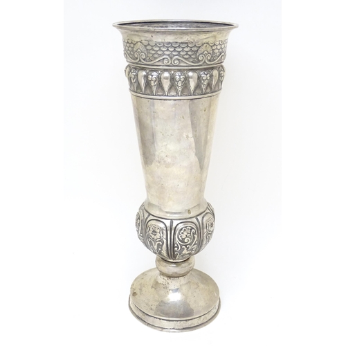 362 - A large Russian silver pedestal vase with floral and scroll decoration. Approx. 14