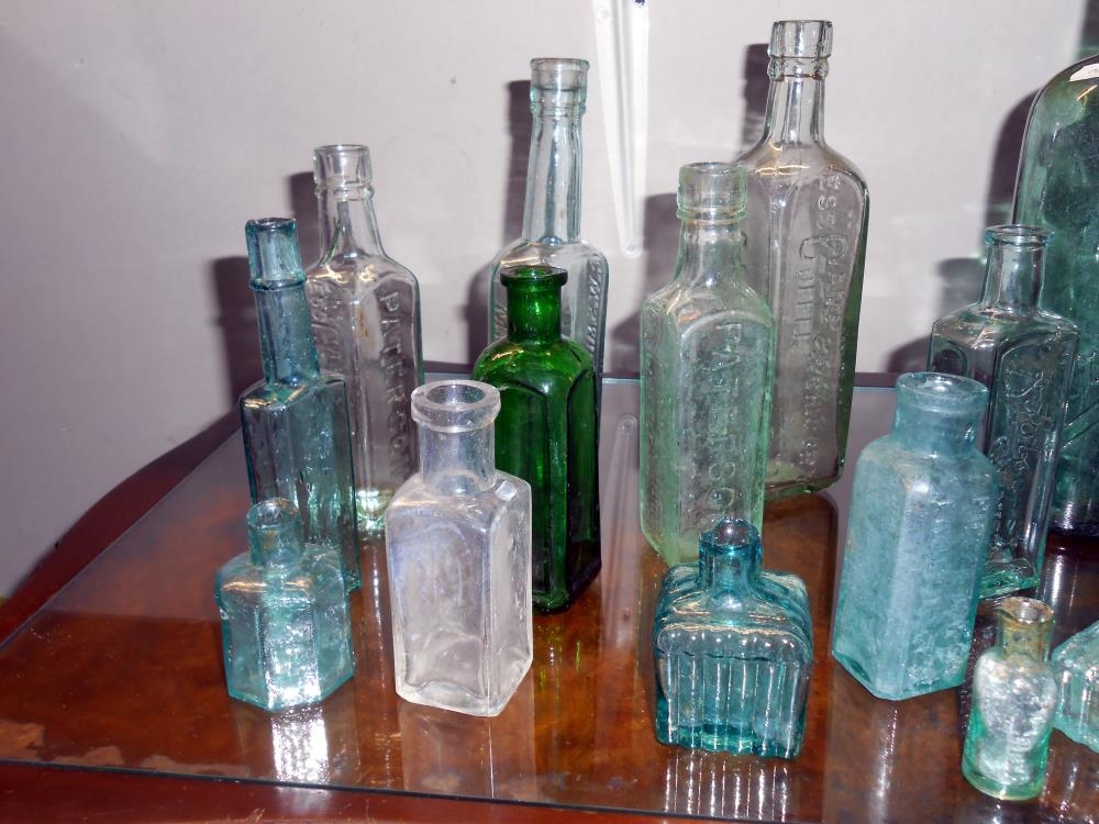 a-quantity-of-antique-glass-bottles