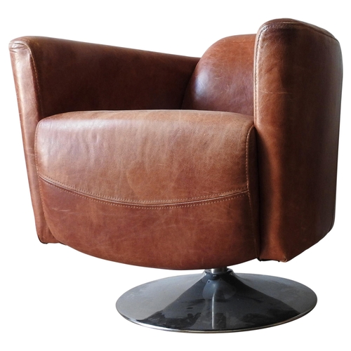 A CONTEMPORARY TAN LEATHER SWIVEL TUB CHAIR, stylish swept back shape, of superb faded worn appearance, on a circular chromed pedestal base, 80 x 68 x 84 cm