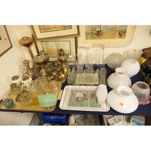 1 - Good selection of oil lamp spares including brass bases; one surmounted with an orange glass tank, p... 