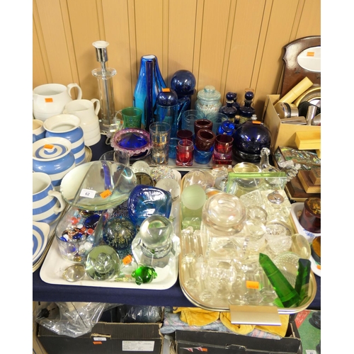 62 - Mixed coloured and plain glassware including blue stoppered poison bottles, tealight holders, table ... 