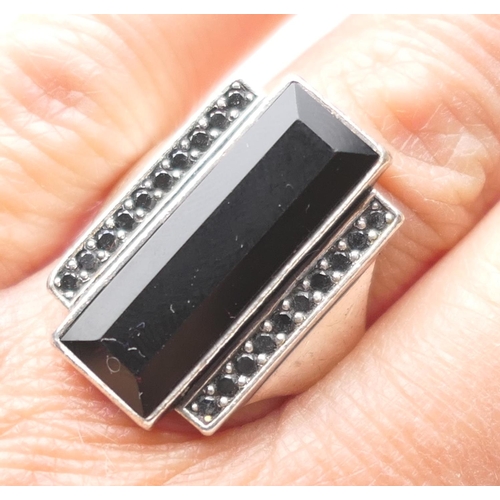 442 - Georg Jensen Nocturn silver ring, in Art Deco style inset with black onyx flanked by two rows of rou... 