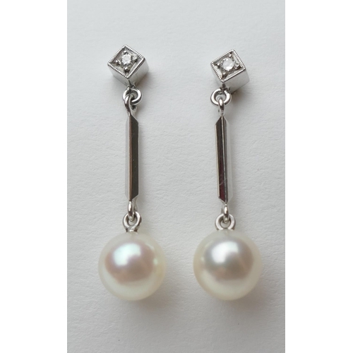 372 - Pair of diamond and cultured pearl pendant earrings, in 14ct white gold, the pearls of approx. 13 me... 