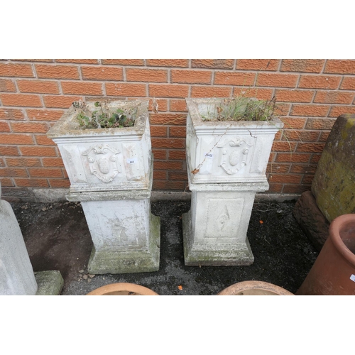 803 - Pair of reconstituted stone square planters on plinths