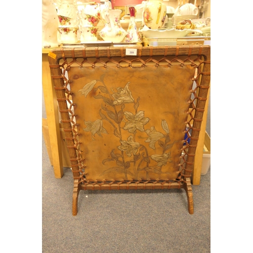 399 - Arts & Crafts period oak and tooled leather firescreen